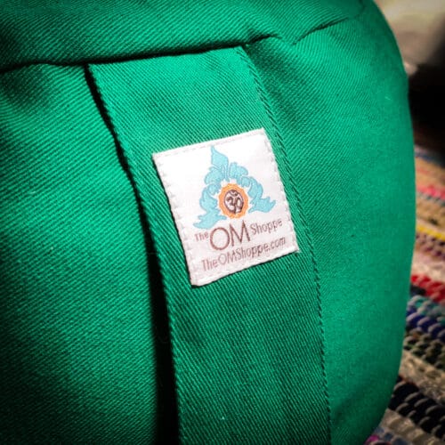 green zafu heart chakra with OM symbol